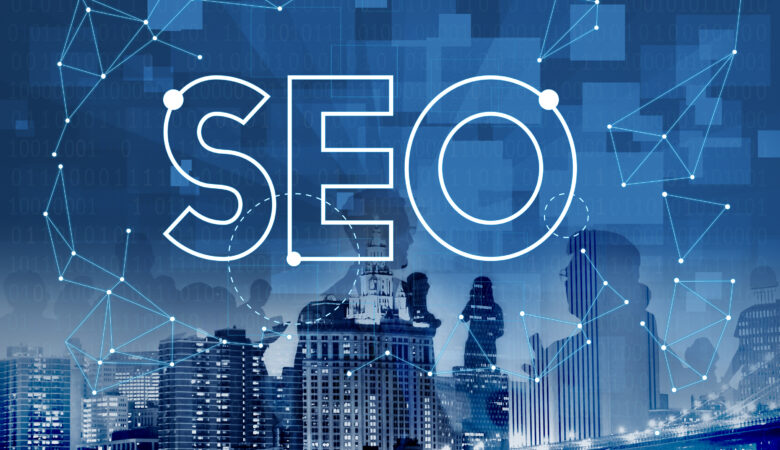 "An abstract digital illustration themed around SEO (Search Engine Optimization). The large text 'SEO' appears in the center over a blue background featuring a city skyline. Digital elements, such as binary code (1s and 0s), geometric connections, and data nodes, overlay the background, symbolizing technology and data analytics. Faint silhouettes of people are also visible, representing collaboration and networking within the SEO industry."