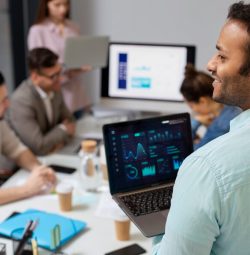 A group of professionals is collaborating in a modern office setting.